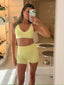 Daily Shorts in Butter, mirror selfie of model wearing the shorts with the matching Daily Sports Bra in Butter