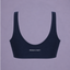 Daily Sports Bra in Midnight Navy, ghost mannequin back view showing deep scoop back and small white Prince x Mott logo