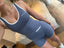 Stride Crop in Platinum, high-angle selfie of model wearing the crop with white piping and matching Stride Shorts